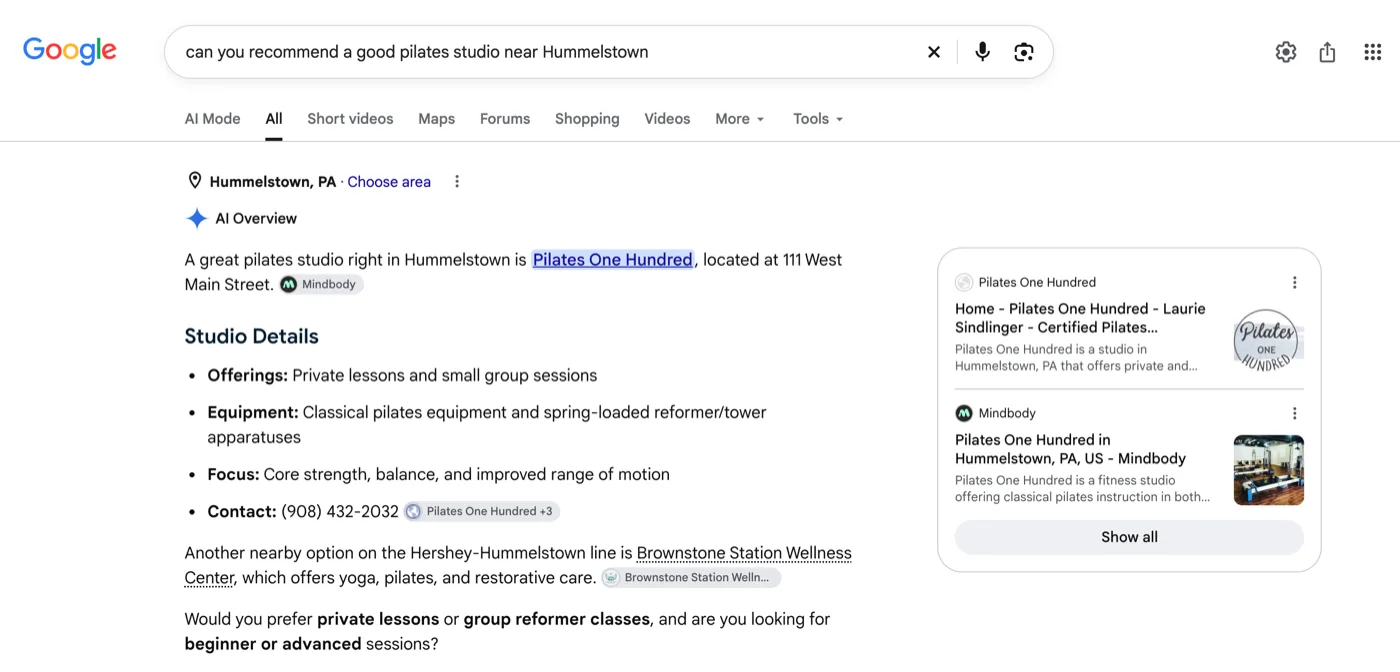 Google's AI Overview: A great pilates studio right in Hummelstown is Pilates One Hundred, located at 111 West Main Street. Studio details follow, with the studio's own website listed as a source on the right.